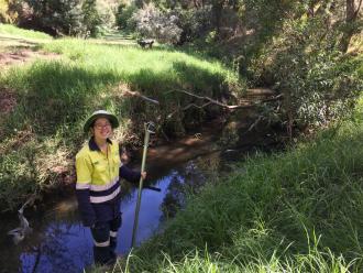 Green Army team member at sampling site