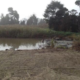 Dam in the creek reinstated after freeway works
