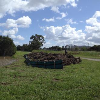 Dredged material from the lake near the inlet to the wetland