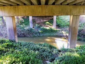 View looking east under bridge