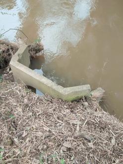 Bank erosion, storm water outlet moved