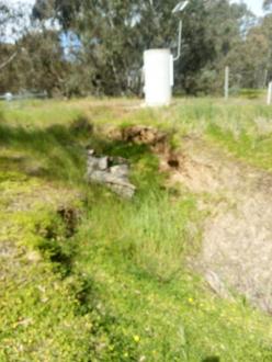 Erosion from man made gutter