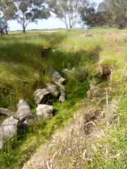 Erosion from man made gutter