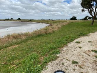 Very shallow water near shore; sand areas exposed