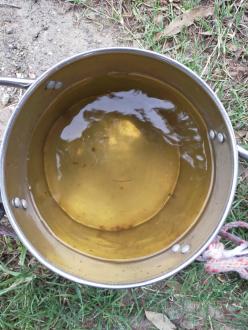 Stained water in collection bucket