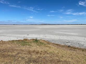 Lake Beeac completely dry. Salt pan. Light patches in the distance are blue sky on salt.  A mirage, not water.
