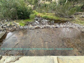 NC-TUL300. Showing creek is back to flowing under road bridge.