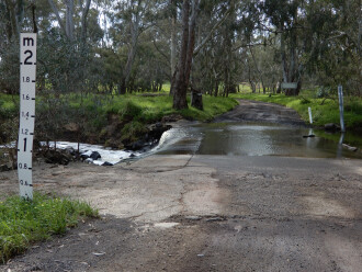 taken on 4/09/2026 showing water flowing across roadway